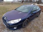 Samochód osobowy  Peugeot 407  koloru granatowego, sedan. Widoczne odpryski na lakierze. 