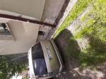 Samochód osobowy Ford Focus w kolorze srebrnym, pojazd uszkodzony- tył 